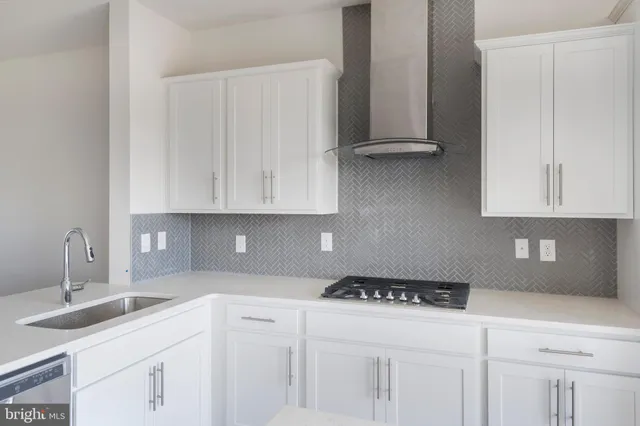 a kitchen with a sink cabinets and appliances