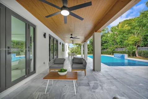 a view of a swimming pool with a patio