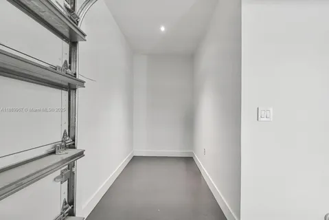 a view of a house with a yard and potted plants