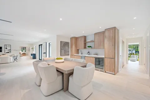 a living room with furniture a dining table and chairs