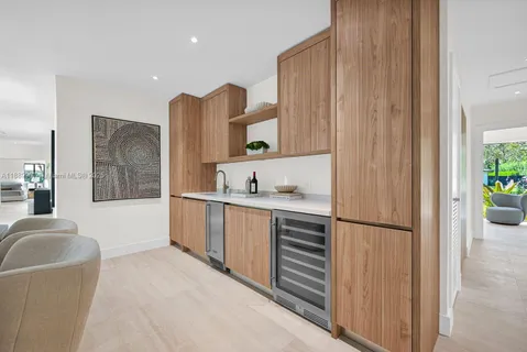a spacious bathroom with a tub sink and mirror