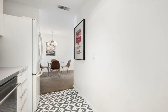 a bedroom with a bed and a tv