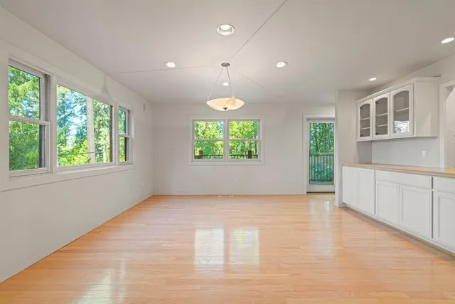 a kitchen with a refrigerator and a stove