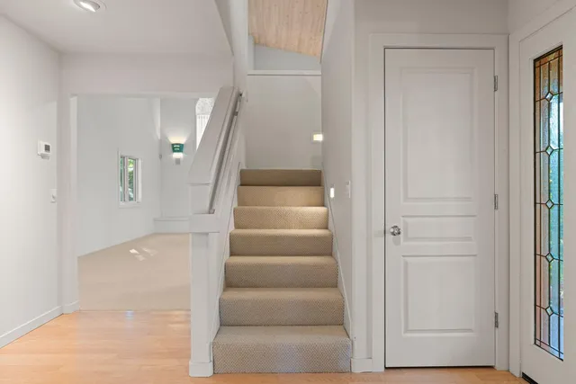 a view of an entryway with wooden floor
