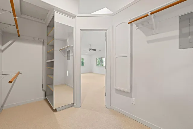 a kitchen with white cabinets and a stove