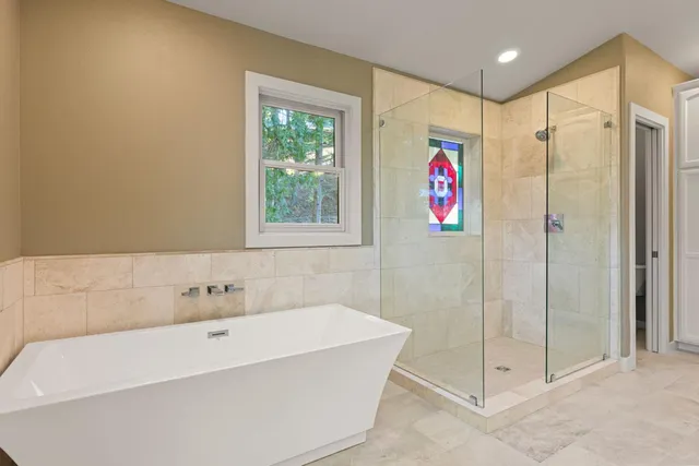 a backyard of a house with outdoor seating