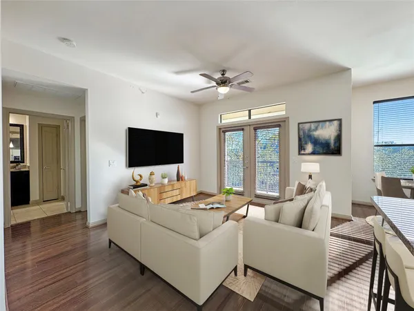 a living room with furniture fireplace and a flat screen tv