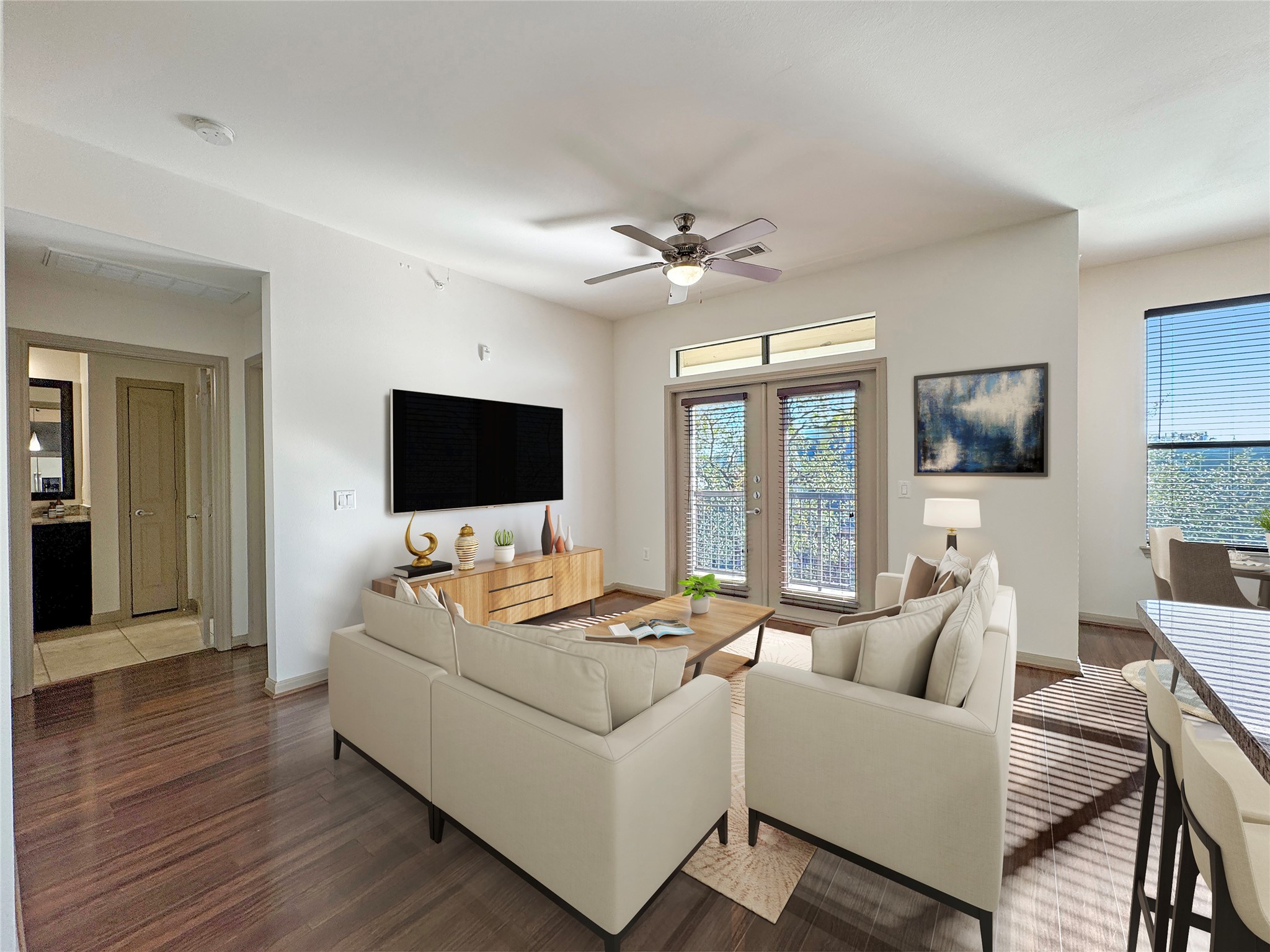Living room with plenty of natural light. You will have a balcony with amazing downtown view.