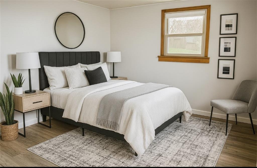 1339 Freeport Road Kittanning, PA 16201 - Photo 11 of 25 a bedroom with a bed a mirror and a lamp on dresser