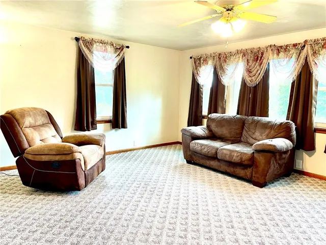 a living room with a couch and a window