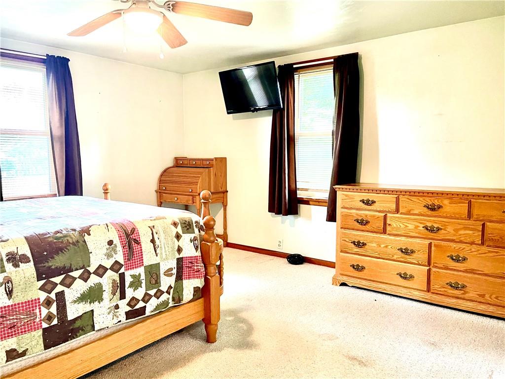 1339 Freeport Road Kittanning, PA 16201 - Photo 19 of 25 a bedroom with a bed and a flat tv screen on dresser