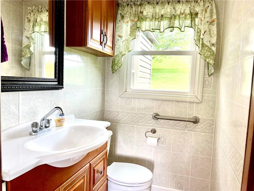 1339 Freeport Road Kittanning, PA 16201 - Photo 24 of 25 a bathroom with a sink toilet and mirror