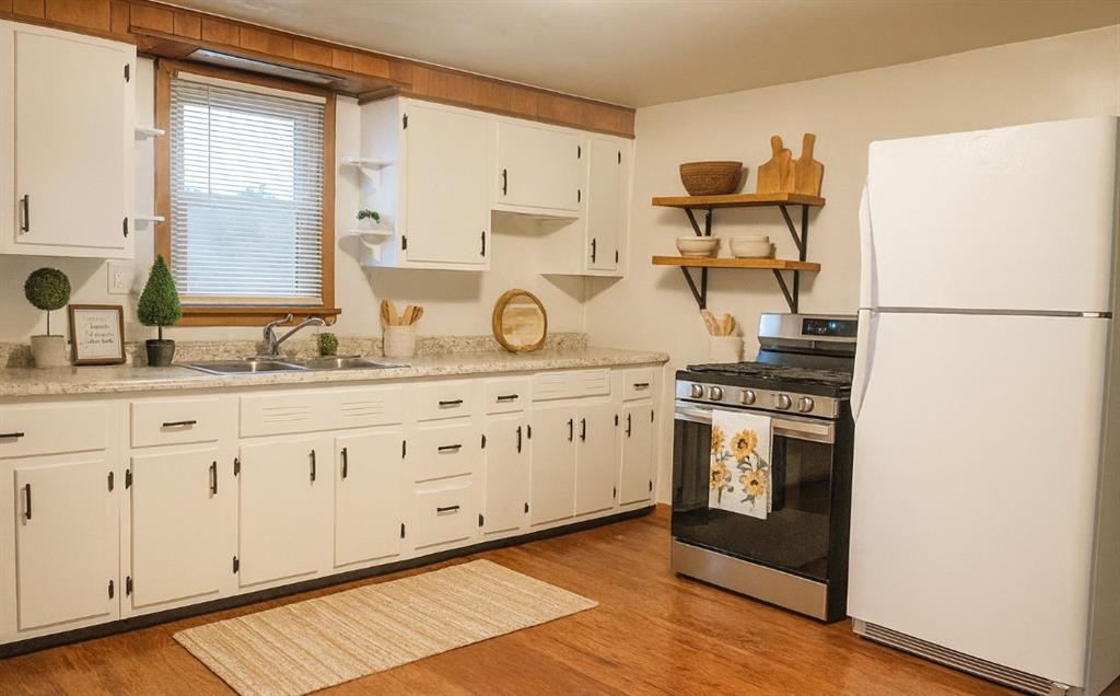 1339 Freeport Road Kittanning, PA 16201 - Photo 7 of 25 a kitchen with stainless steel appliances granite countertop a refrigerator and a stove