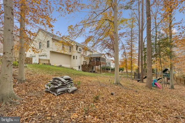 a backyard of a house with barbeque oven