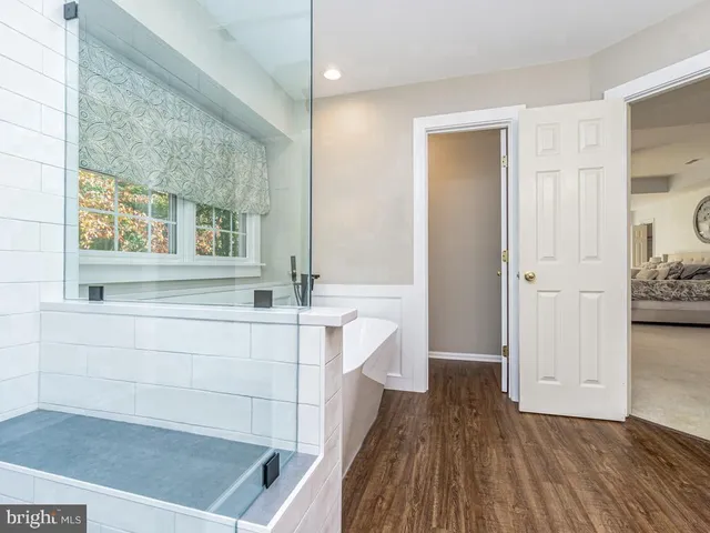 a bathroom with a bathtub and a sink