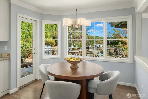 a dining room with furniture and window