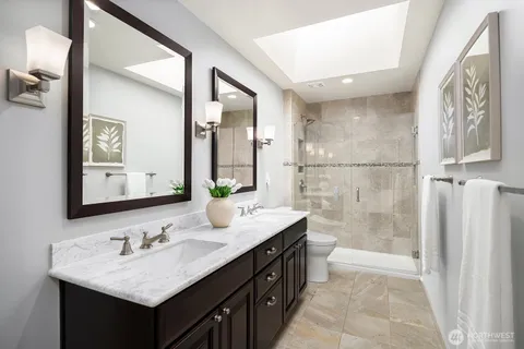 a bathroom with a sink double vanity and a mirror