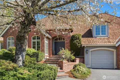 front view of a house with potted plants