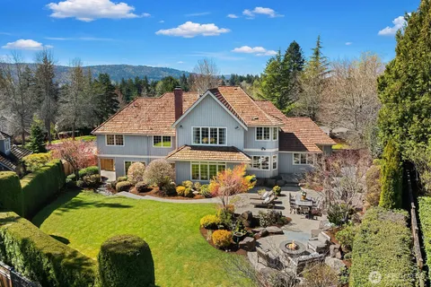 a view of a house with garden and sitting area