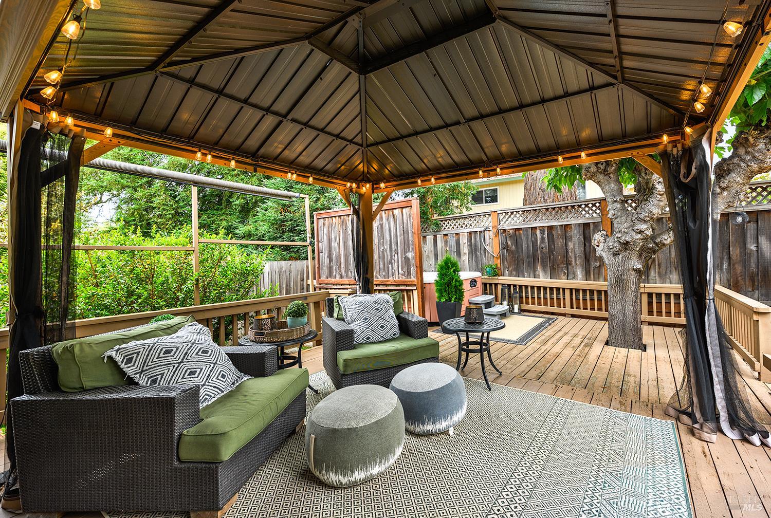 5313 Yerba Buena Road Santa Rosa, CA 95409 - Photo 20 of 34 The covered deck and arbor create an inviting outdoor living space, perfect for relaxing, dining, or entertaining year-round.