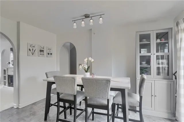 a dining room with furniture and window