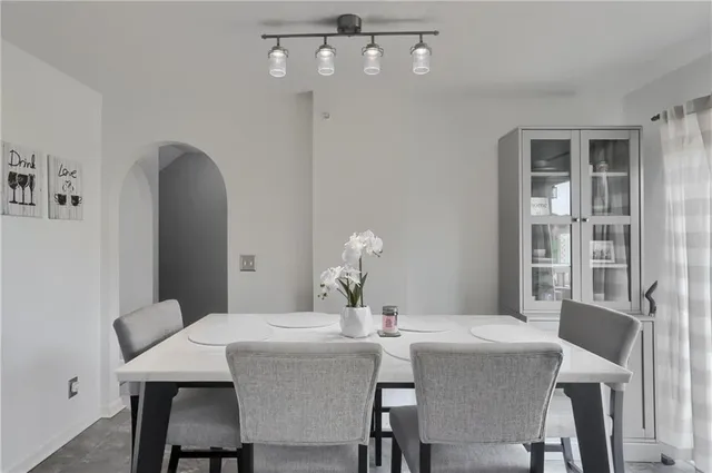 a dining room with furniture and window