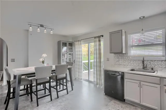 a view of a dining room with furniture and window