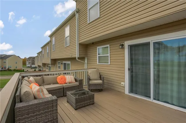 a view of roof deck with furniture