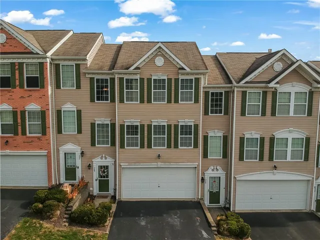 a view of residential houses with street