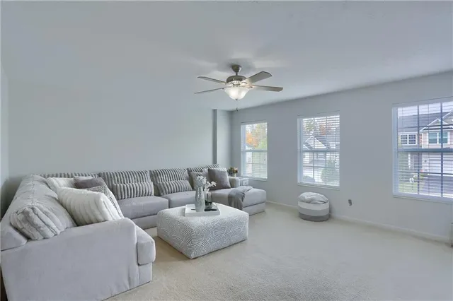 a living room with furniture and windows