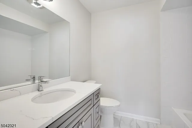 a bathroom with a sink and a toilet