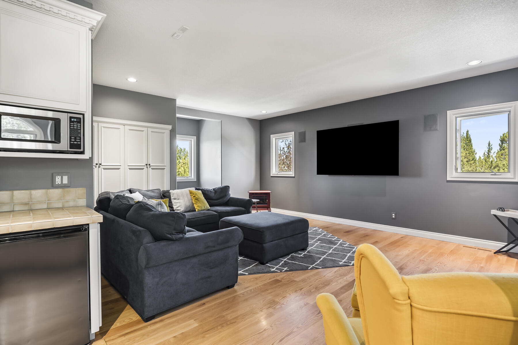 61445 Gosney Road Bend, OR 97702 - Photo 54 of 83 a living room with furniture and a flat screen tv