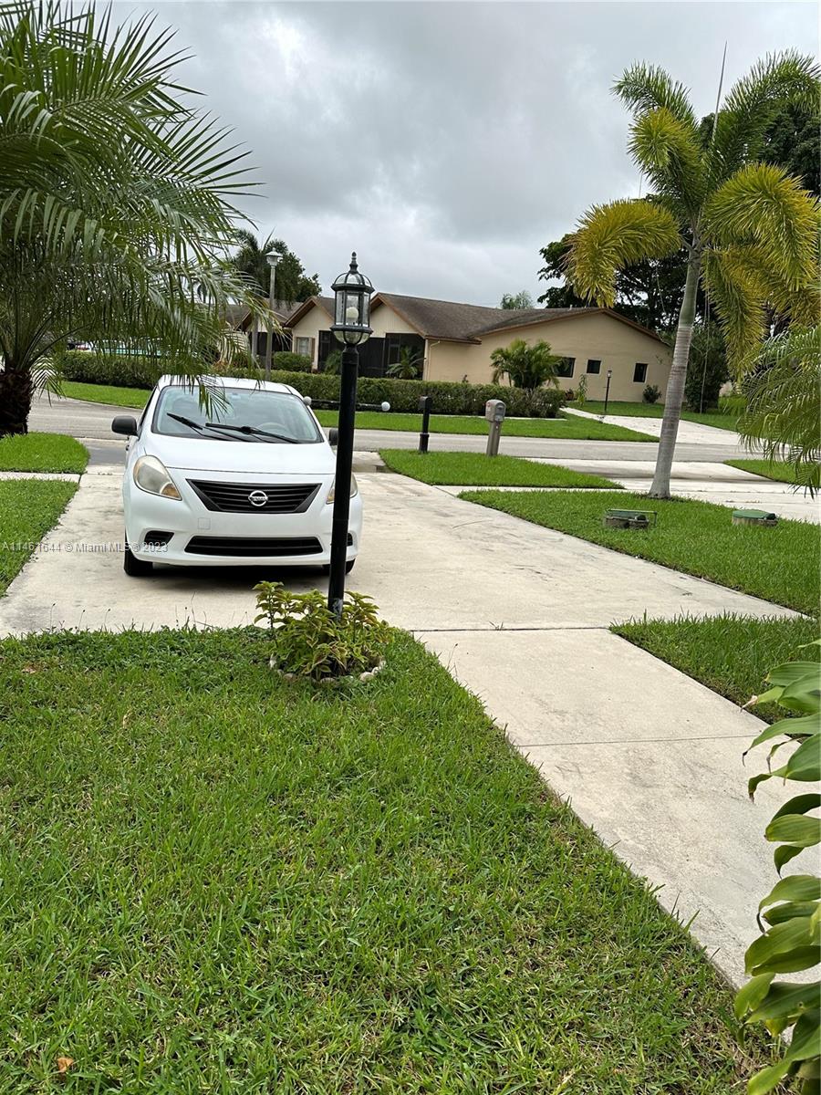 14711 Edna Way Delray Beach, FL 33484 - Photo 23 of 23 a car parked on the side of the road