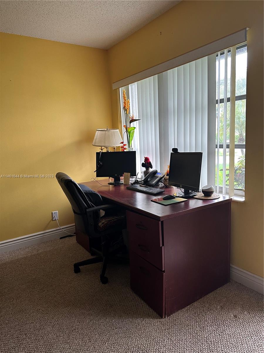 14711 Edna Way Delray Beach, FL 33484 - Photo 6 of 23 a view of a workspace with furniture