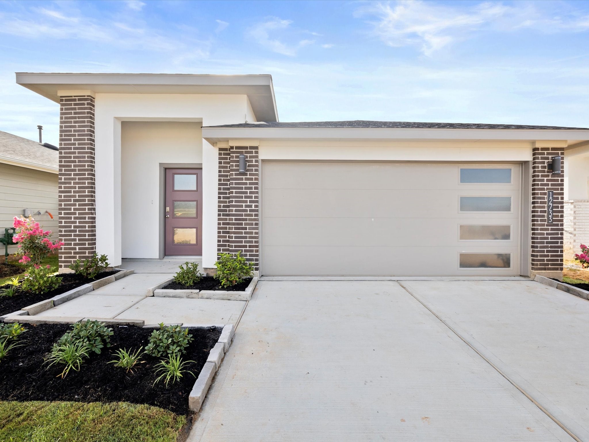 front view of a house with a yard