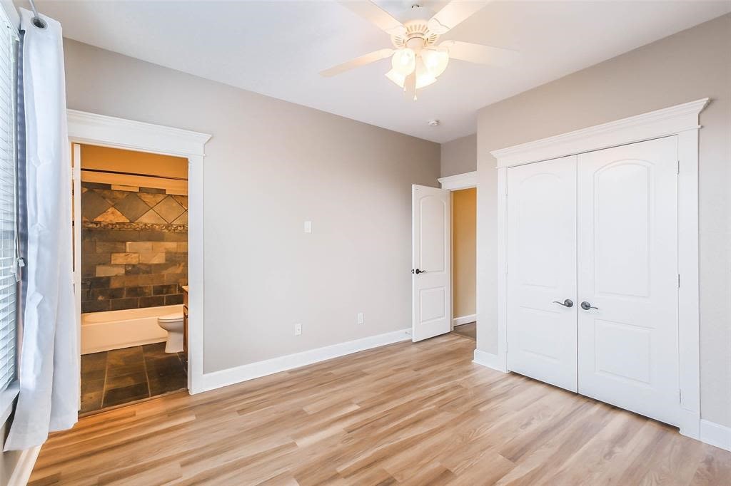706 Allston Street, Unit B Houston, TX 77007 - Photo 20 of 33 wooden floor in an empty room with a window