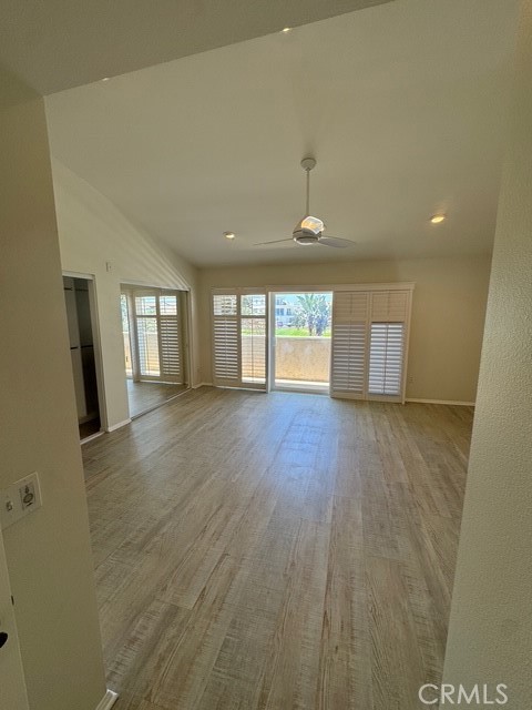 4455 West Coast Highway, Unit 23 Newport Beach, CA 92663 - Photo 15 of 30 wooden floor in an empty room with a window