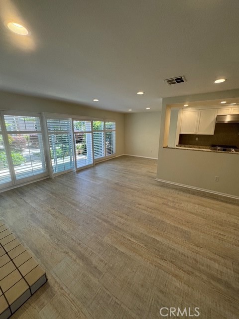 4455 West Coast Highway, Unit 23 Newport Beach, CA 92663 - Photo 27 of 30 an empty room with large windows