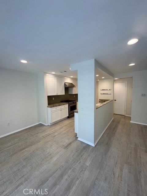 4455 West Coast Highway, Unit 23 Newport Beach, CA 92663 - Photo 28 of 30 a view of a kitchen with a sink and a refrigerator