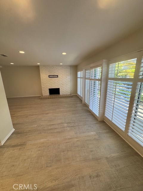 4455 West Coast Highway, Unit 23 Newport Beach, CA 92663 - Photo 29 of 30 a view of a livingroom with a fireplace