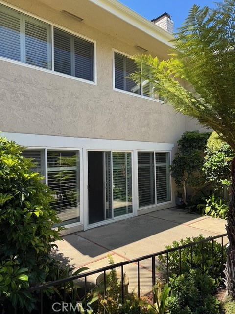 4455 West Coast Highway, Unit 23 Newport Beach, CA 92663 - Photo 30 of 30 a front view of a house having yard