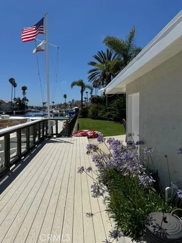 a view of a balcony with wooden floor