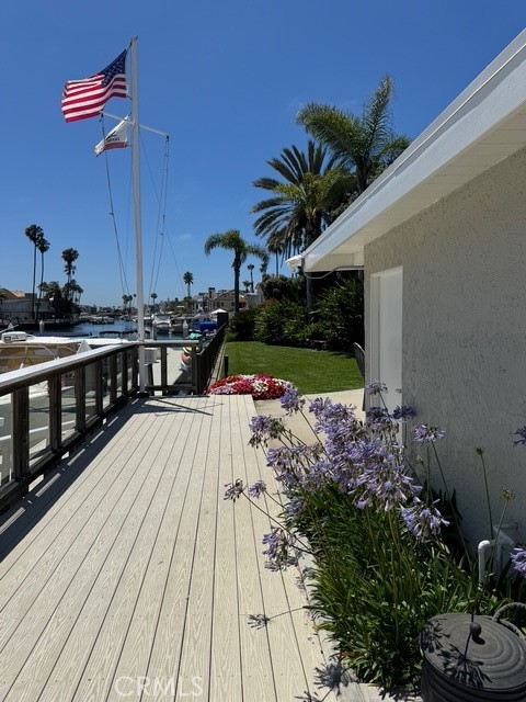 4455 West Coast Highway, Unit 23 Newport Beach, CA 92663 - Photo 7 of 30 a view of a balcony with wooden floor