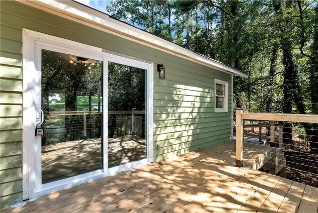 a backyard of a house with table and chairs