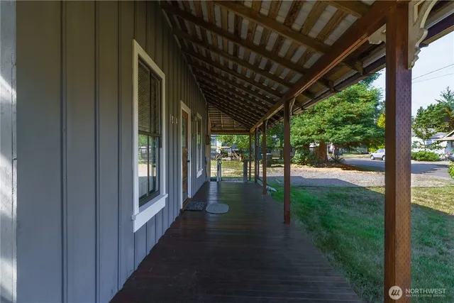 a view of a porch with wooden floor and outdoor space