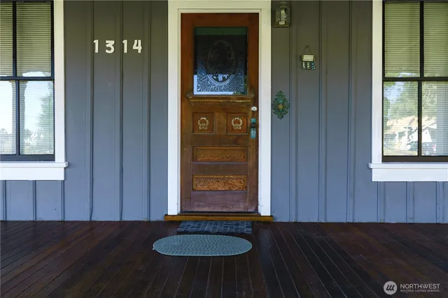 a living room with furniture and windows