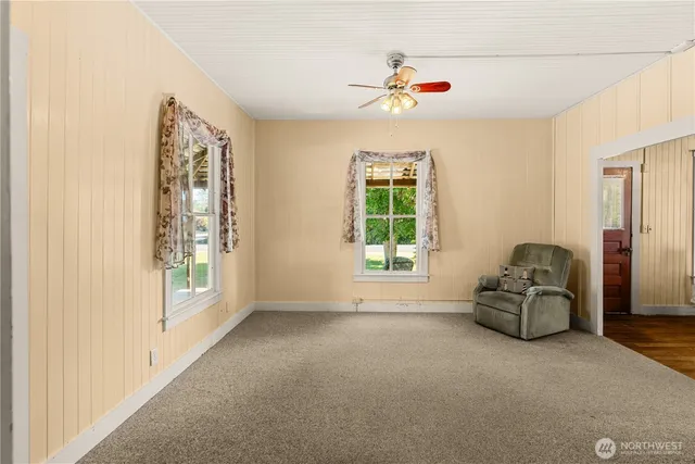 a living room with furniture and windows