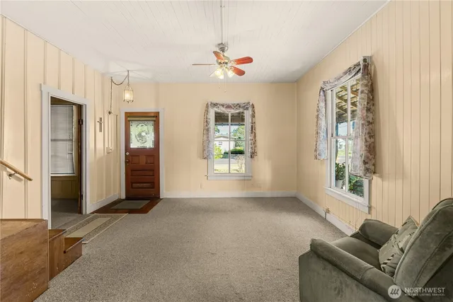a view of room with window and hallway