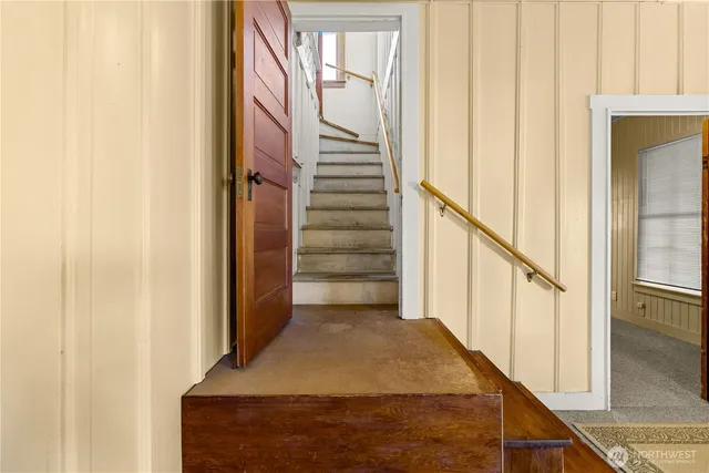 a view of a a dining room with furniture window and wooden floor