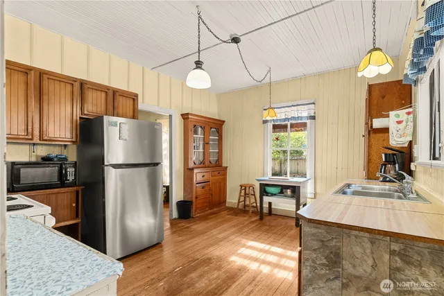a bathroom with a bathtub and a window